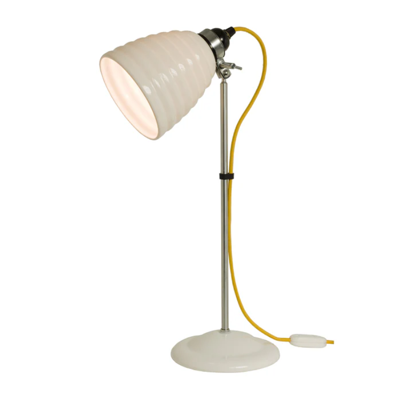 The Hector Bibendum Table Light from Original BTC in yellow in a studio.