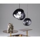 The Melt Mini Pendant from Tom Dixon in a living room showing the size options.