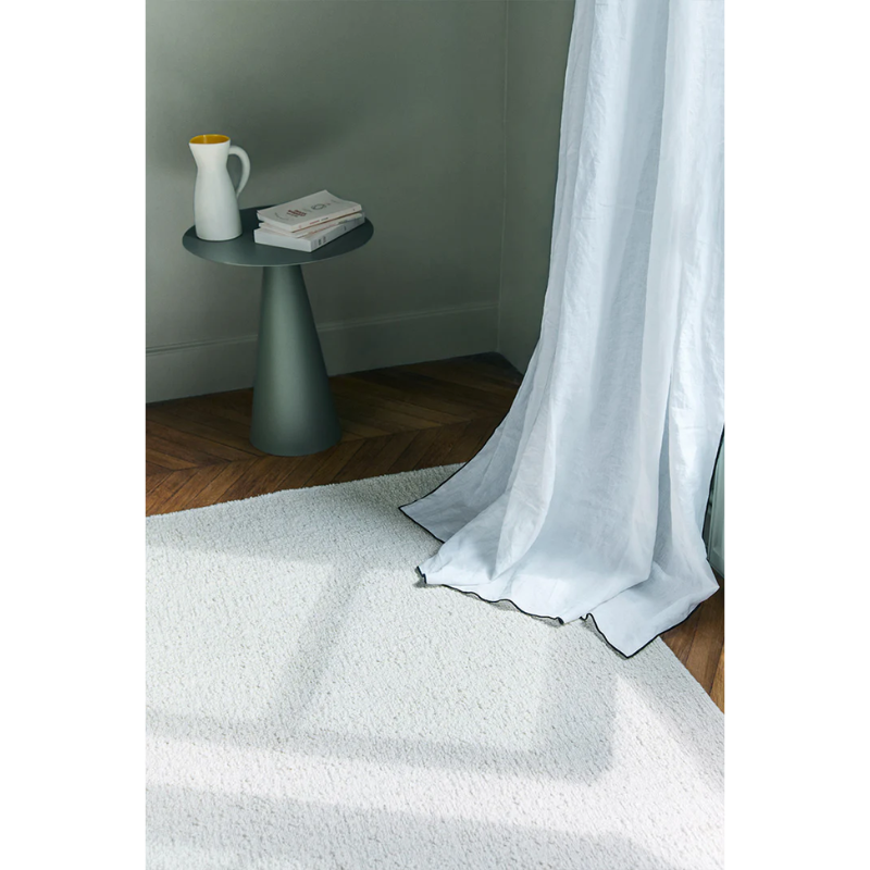 The Astrakan Neige Wool Rug from Toulemonde Bochart in a lounge.