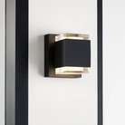 The Voto Uplight and Downlight Outdoor Wall Sconce from Visual Comfort & Co in a living room.