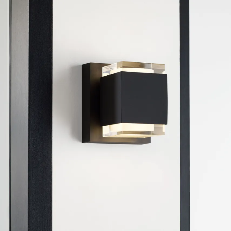 The Voto Uplight and Downlight Outdoor Wall Sconce from Visual Comfort & Co in a living room.