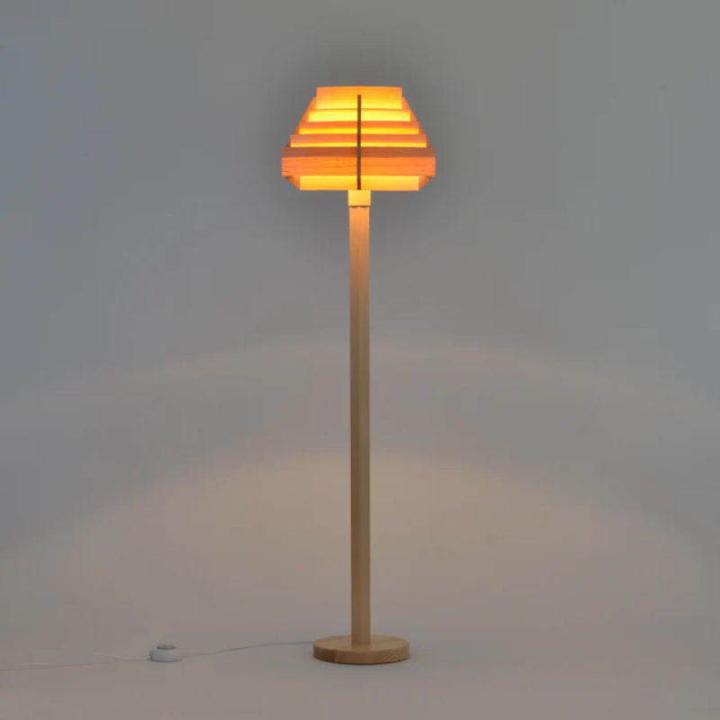 The Jakobsson Floor Lamp from Yamagiwa lit in a studio.