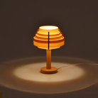 The Small Jakobsson Table Lamp from Yamagiwa in a studio turned on.