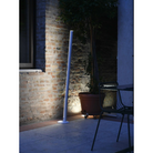 The Pencil Light Module with Docking Station from Zafferano in an outdoor garden.