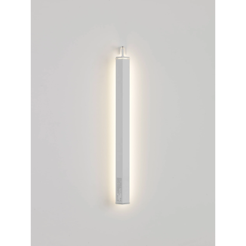 The Pencil Light - Vertical Wall Mount from Zafferano in a living room.