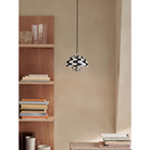 The Flowerpot VP1 Pendant from &Tradition in a living room.