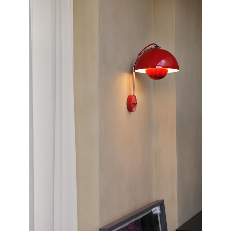 The Flowerpot VP8 Wall Sconce from &Tradition in a living room.