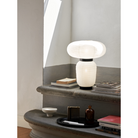 The Formakami JH18 Table Lamp from &Tradition in a living room.