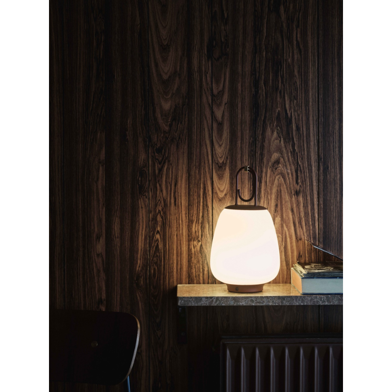 The Lucca Portable Lamp from &Tradition in a lounge.