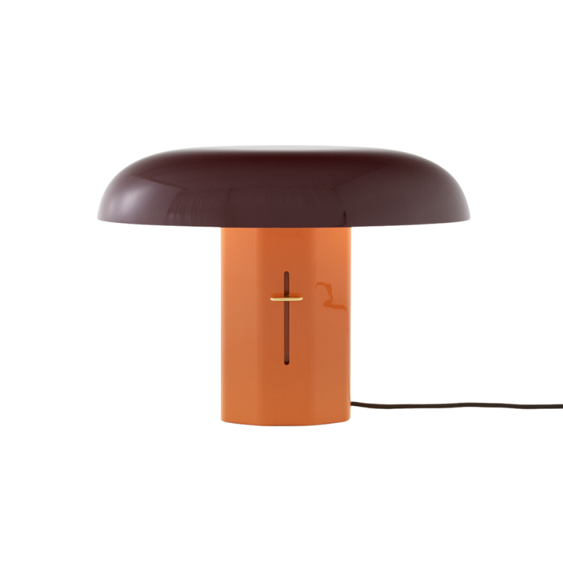 The Montera Table Lamp from &Tradition in amber and ruby.