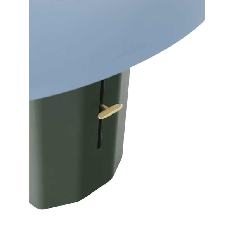 The Montera Table Lamp from &Tradition in forest and sky in a close up.