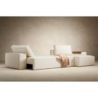 The Newilla sectional sleeper sofa with lounger converted in living room