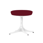 The Nelson Pedestal Stool from Herman Miller with dark crimson hopsak upholstery.