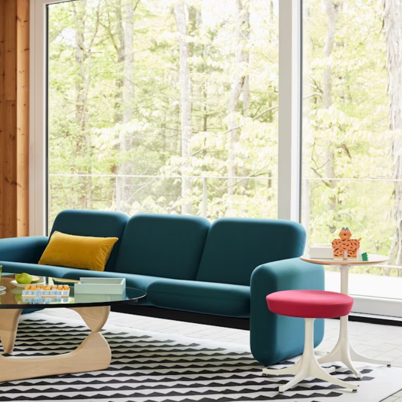 The Nelson Pedestal Stool from Herman Miller in a living room.