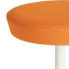 The Nelson Pedestal Stool from Herman Miller seat in orange hopsak upholstery.