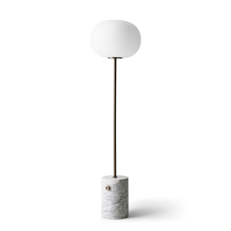 The JWDA Floor Lamp from Audo Copenhagen in travertine and brushed brass angled.