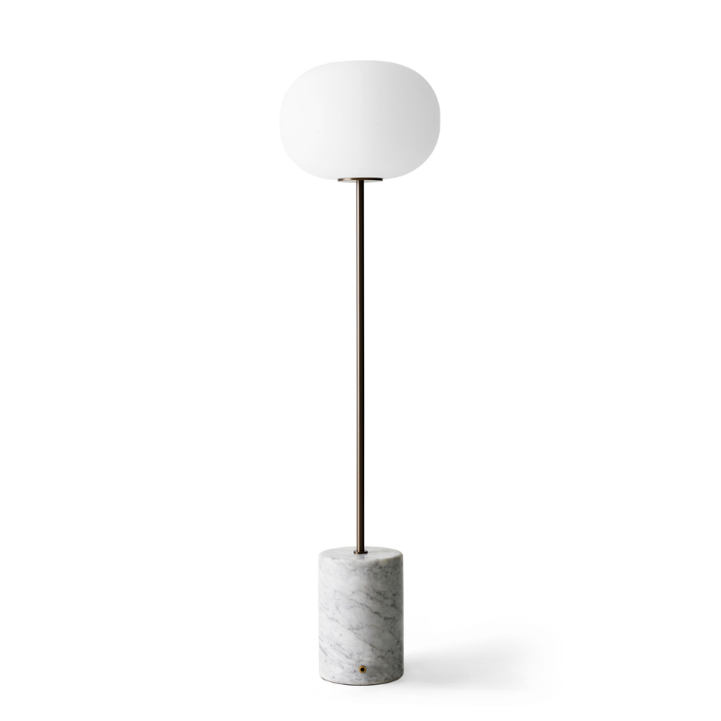 The JWDA Floor Lamp from Audo Copenhagen in travertine and brushed brass from the back.