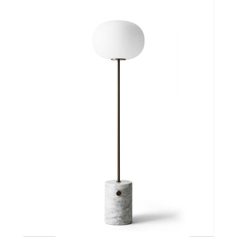 The JWDA Floor Lamp from Audo Copenhagen in travertine and brushed brass.