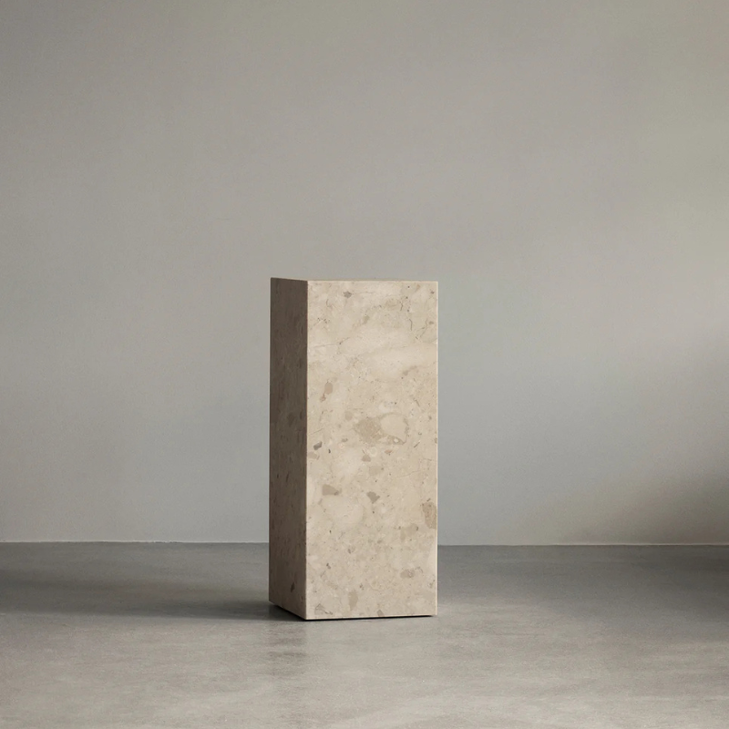 The Marble Plinth Pedestal from Audo Copenhagen in a display.