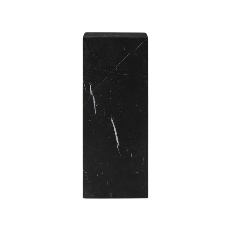 The Marble Plinth Pedestal from Audo Copenhagen made from nero marquina marble.