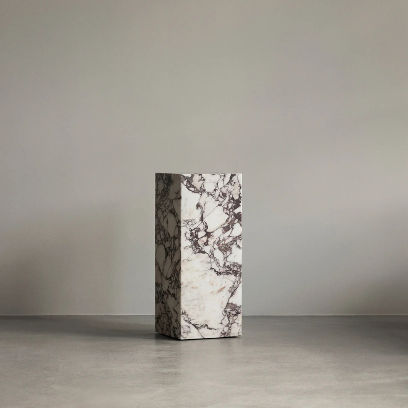 The Marble Plinth Pedestal from Audo Copenhagen in a studio.