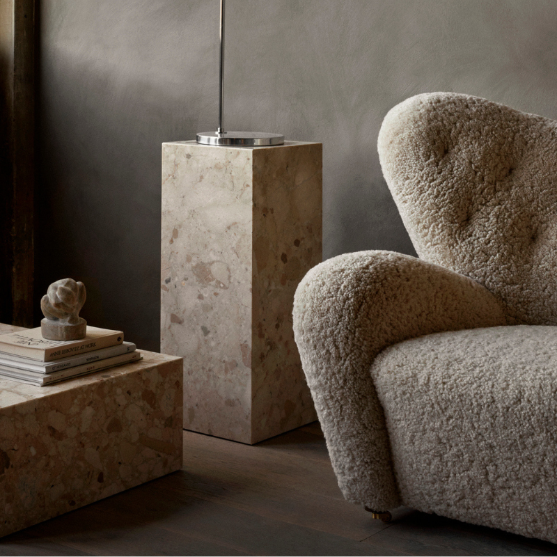 The Tired Man Sheepskin Lounge Chair from Audo Copenhagen in a living space.