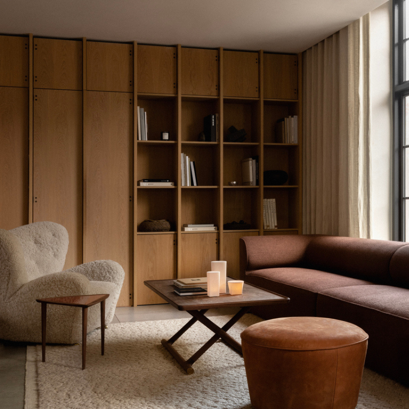 The Tired Man Sheepskin Lounge Chair from Audo Copenhagen in an office.