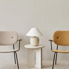 The 37 inch Torso Table Lamp by Audo Copenhagen with Co Lounge Chairs.