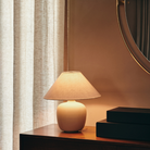 The 37 inch Torso Table Lamp by Audo Copenhagen in a living space.