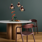 The 4/4 Round Dining Table from Blu Dot in a dining room.