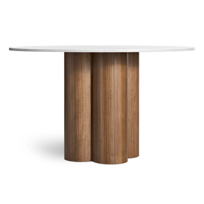 The 48 inch 4/4 Round Dining Table from Blu Dot with marble top and walnut base from the side.