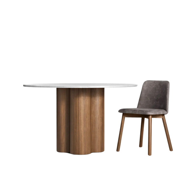 The 48 inch 4/4 Round Dining Table from Blu Dot with marble top and walnut base in a studio.