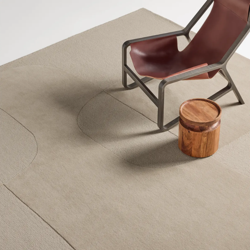 Bob and Weave Rug by Blu Dot in Sand in a living room available at Illuminée