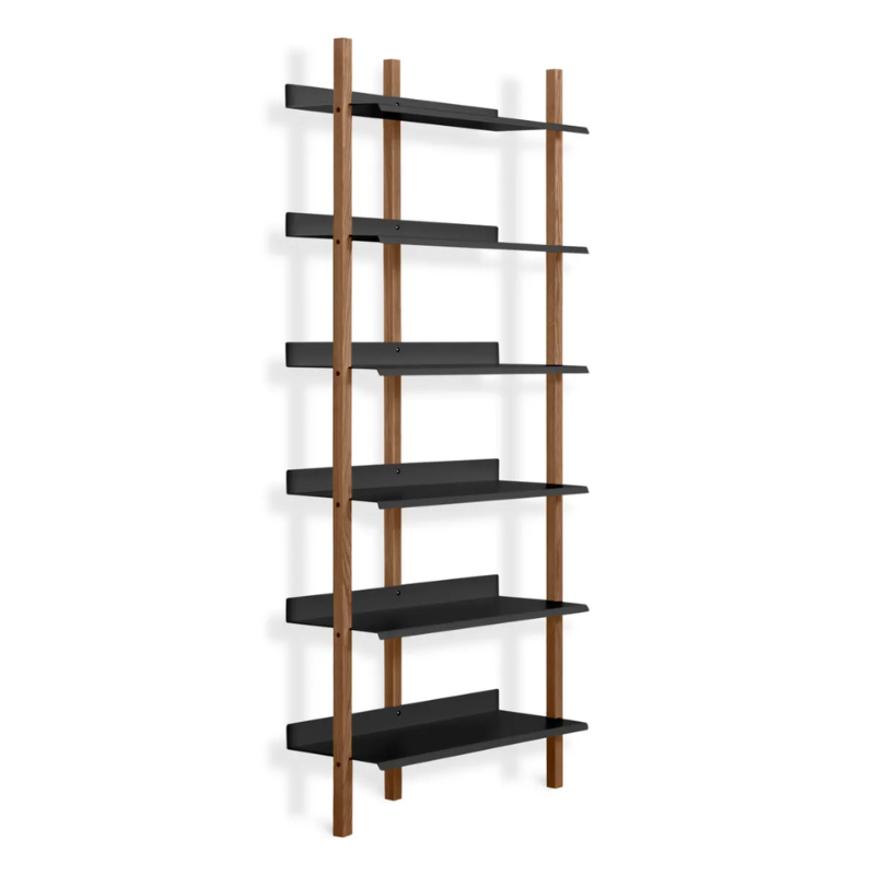 The Browser Tall Bookcase from Blu Dot with walnut uprights and oblivion shelving from an angle.