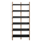 The Browser Tall Bookcase from Blu Dot with walnut uprights and oblivion shelving.