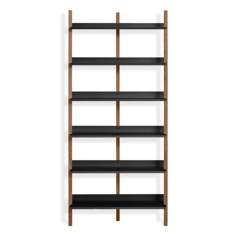 The Browser Tall Bookcase from Blu Dot with walnut uprights and oblivion shelving.