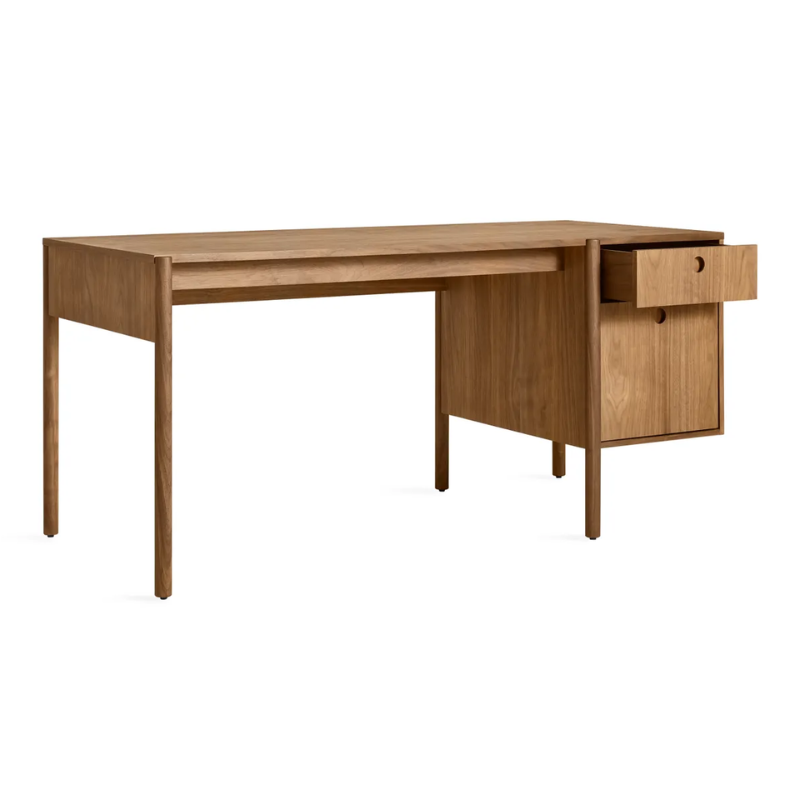 The Cursive Desk from Blu Dot in walnut with an open drawer.