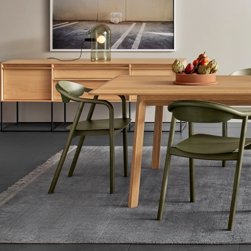 The Dibs Chair from Blu Dot in a dining room.