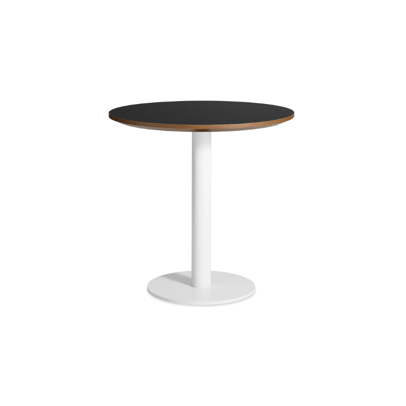 The 30 inch round Easy Dining Table from Blu Dot with a black laminate top and white base from an angle.