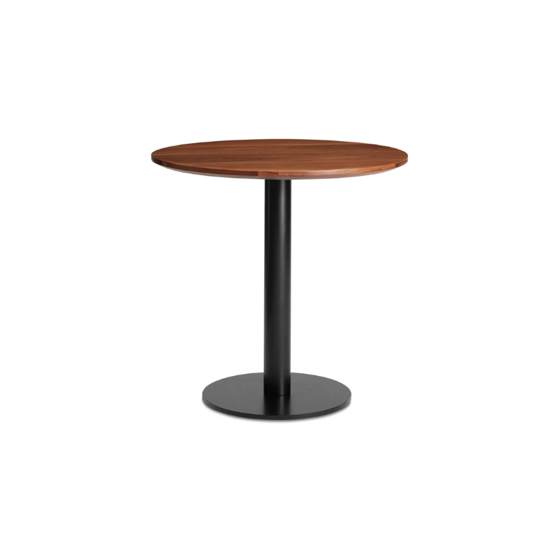 The 30 inch round Easy Dining Table from Blu Dot with a walnut top and black base from an angle.