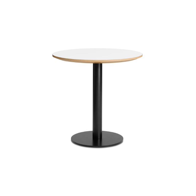 The 30 inch round Easy Dining Table from Blu Dot with a white laminate top and black base from an angle.