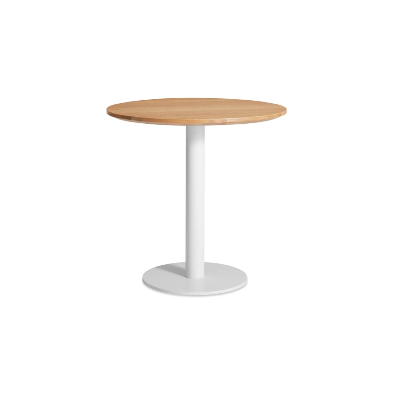 The 30 inch round Easy Dining Table from Blu Dot with a white oak top and white base from an angle.