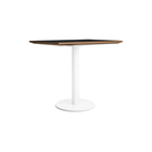 The 32 inch rectangular Easy Dining Table from Blu Dot with a black laminate top and white base from an angle.