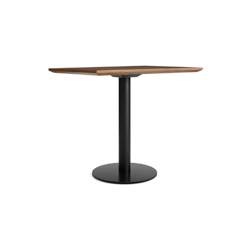 The 32 inch rectangular Easy Dining Table from Blu Dot with a walnut top and black base from an angle.