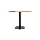 The 32 inch rectangular Easy Dining Table from Blu Dot with a white laminate top and black base from an angle.