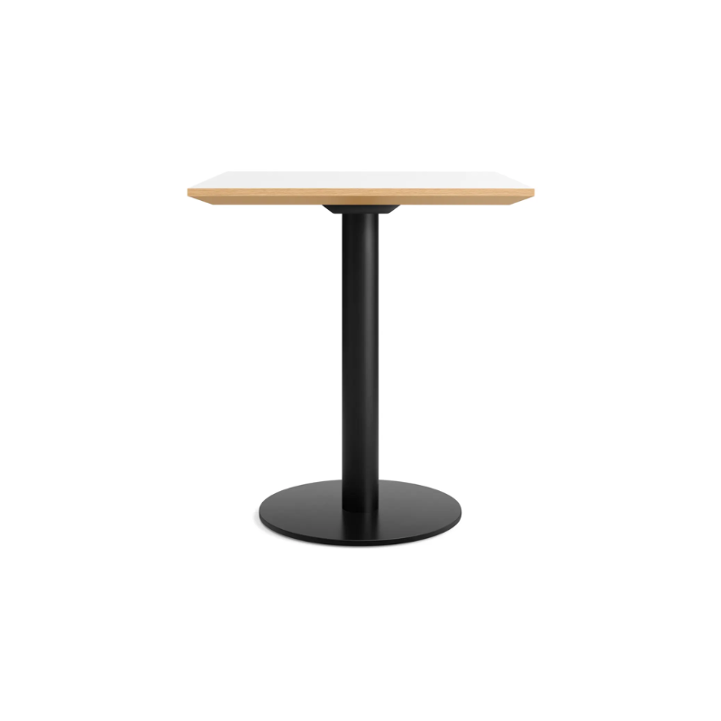 The 32 inch rectangular Easy Dining Table from Blu Dot with a white laminate top and black base from the side.