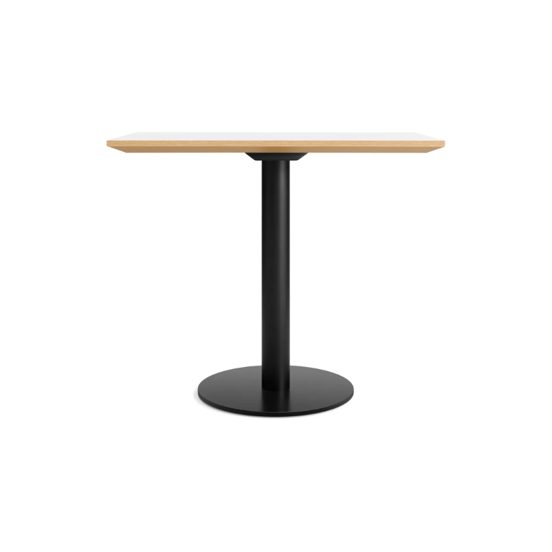 The 32 inch rectangular Easy Dining Table from Blu Dot with a white laminate top and black base.