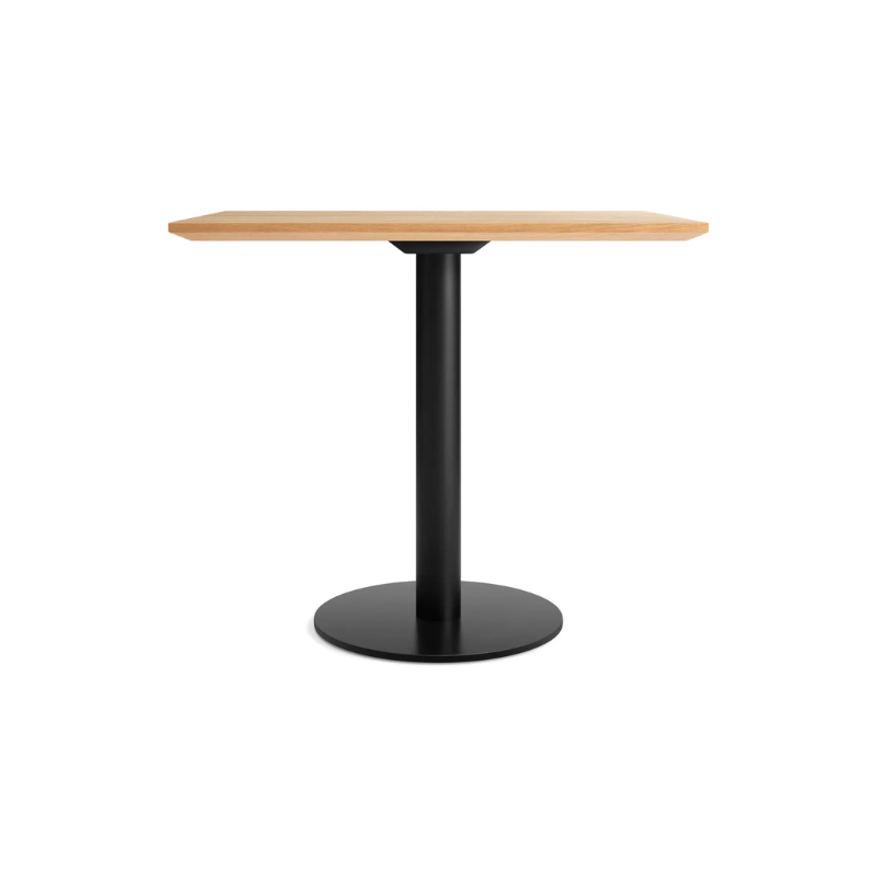 The 32 inch rectangular Easy Dining Table from Blu Dot with a white oak top and black base.