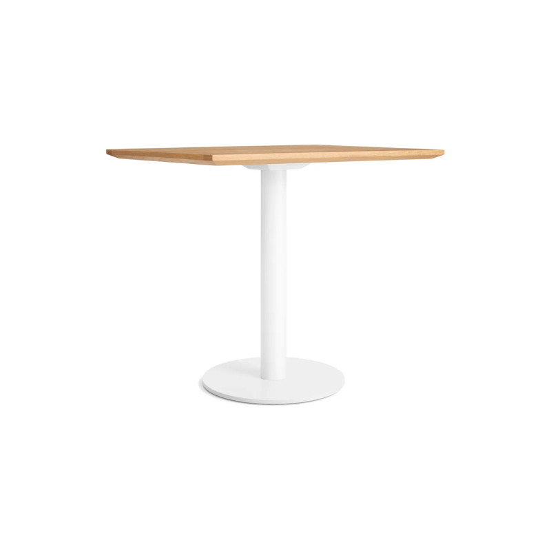 The 32 inch rectangular Easy Dining Table from Blu Dot with a white oak top and white base from an angle.