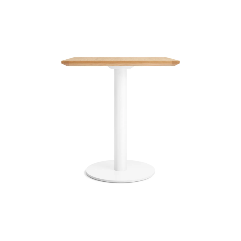 The 32 inch rectangular Easy Dining Table from Blu Dot with a white oak top and white base from the side.